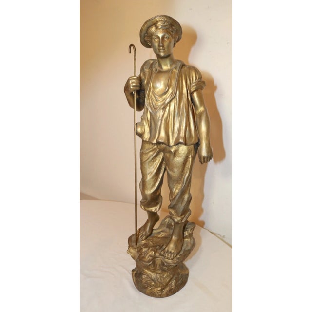 Up for sale is a large antique figural sheep herder paysan statue. It's made of a gold gilded white metal and cast with...