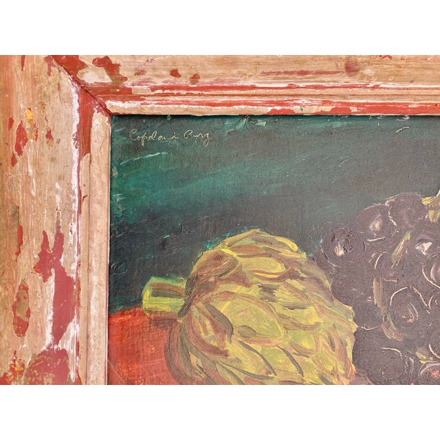This small still life — an artichoke and dark grapes on a warm ochre ground, set against a deep teal — belongs to the...