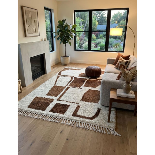 Brown and Ivory Moroccan Rug – Handmade Abstract Berber Wool Rug This striking handmade Moroccan rug features a soft ivory...