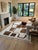 Brown and Ivory Moroccan Rug – Handmade Abstract Berber Wool Rug This striking handmade Moroccan rug features a soft ivory...