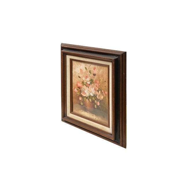 This charming vintage oil painting features a lush, textured floral arrangement of blooming roses and soft buds in cream,...