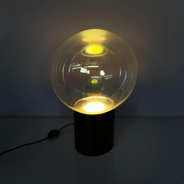 Italian Space Age table lamp by Lumenform, 1970s Table lamp with a spherical diffuser in iridescent Murano glass....