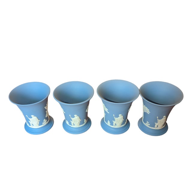 This gorgeous matching set of neoclassical vases is that perfect shade of periwinkle with bas-relief figures and flora in...