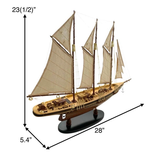 This vintage large model sailing yacht sailboat is a charming and unique addition to any nautical or coastal-themed home...