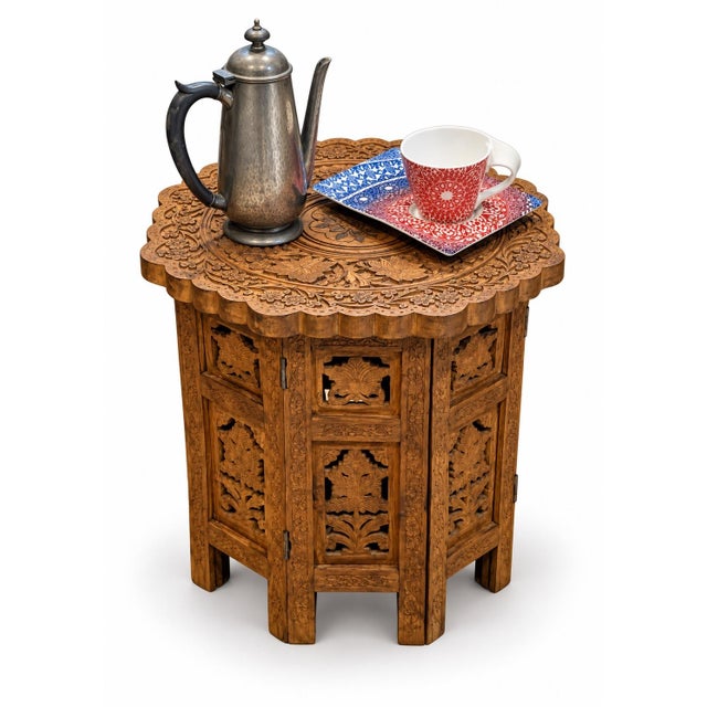 A striking antique carved wooden side table, featuring an exceptionally detailed octagonal form and a beautifully...