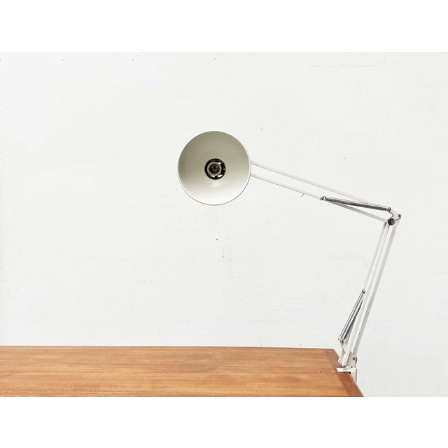 Flexible desk lamp by poulsen, based on a design from 1972. the it desk lamp is based on the designs and principles of...