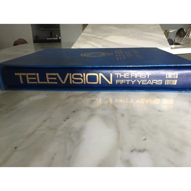 A highly collectible addition to any home, library or office, this deluxe , hand bound, blue padded, genuine leather...