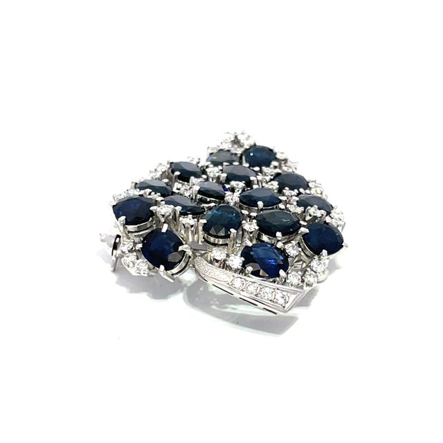 Discover the exquisite elegance of our Blue Sapphire and Diamond Brooch, a stunning piece crafted in luxurious platinum....