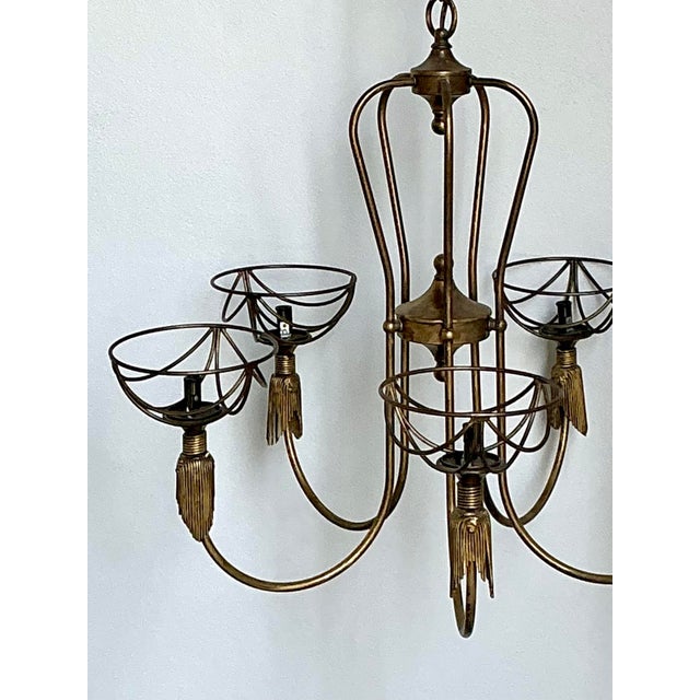 This stunning vintage chandelier by Hinkley Lighting is a masterclass in sophisticated Hollywood Regency design. Crafted...