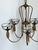 This stunning vintage chandelier by Hinkley Lighting is a masterclass in sophisticated Hollywood Regency design. Crafted...