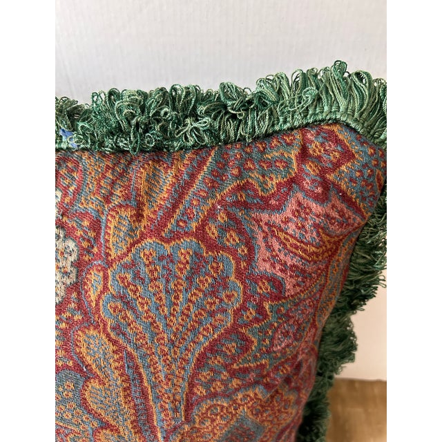 A pillow made from a 19th century hand loomed Scottish wool paisley backed and trimmed with coordinating velvet and trim....