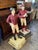 A charming and increasingly difficult-to-find pair of vintage lawn jockey figures, each standing proudly with an...