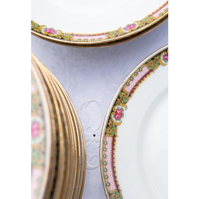 Limoges (LJV France) porcelain with white paste and a border featuring floral motifs in pink and green. They date from...