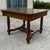 Table with a walnut and root with plane and threaded and inlaid side bands, with four stalks turned, Liberty era. The...