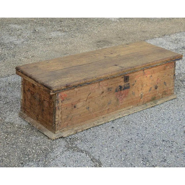 Fir chest with fragments of decorations on the front , worn but with the originality of time giving it a rustic look....