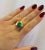 A vintage treasure featuring a stunning 3-carat Colombian emerald cabochon set in 20K yellow gold. The cabochon-cut...