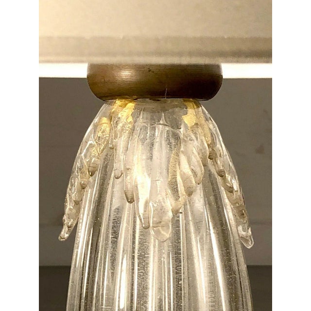 A spectacular, very large and heavy table lamp, massive circular murano glass base open in corolla leding the lamp, of...