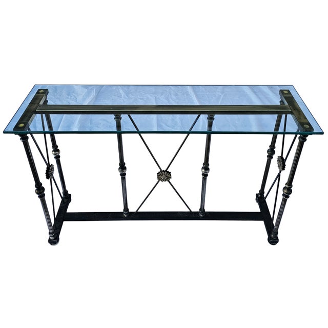 This Vintage Maison Jansen Style Brass and Glass Console is beautiful and refined, with a lovely European flair. Exuding...