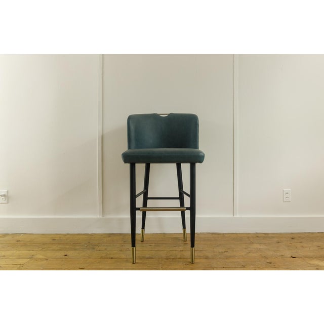 Featuring a luxurious, heavy-duty teal Kravet vinyl seat that delivers a sophisticated splash of color, this set of two...