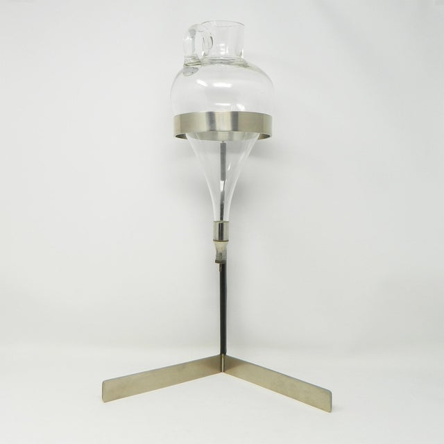 A wine lifter designed by Carl Auböck III for the Auböck workshop in Vienna. It consists of a stainless steel frame,...