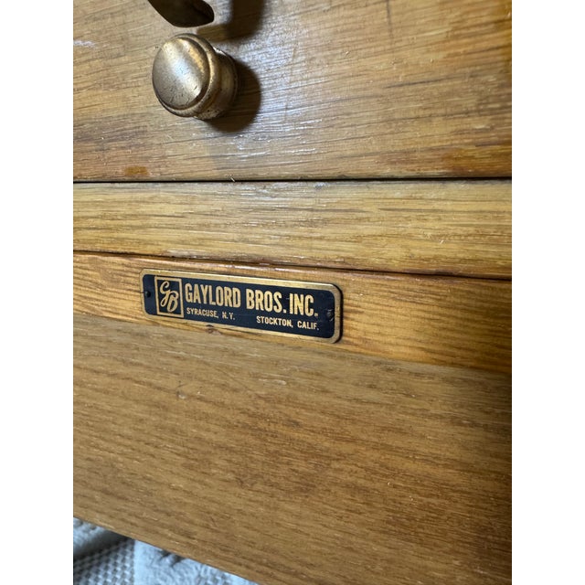 Rare vintage Gaylord Bros., Inc. oak library card catalog cabinet featuring 40 drawers and an original pull-out writing...