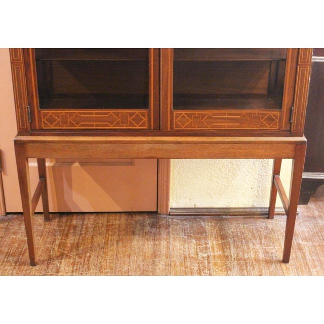 Edwardian period English bookcase cabinet on stand. Mahogany with geometric line inlays. The stand custom made. Mahogany...