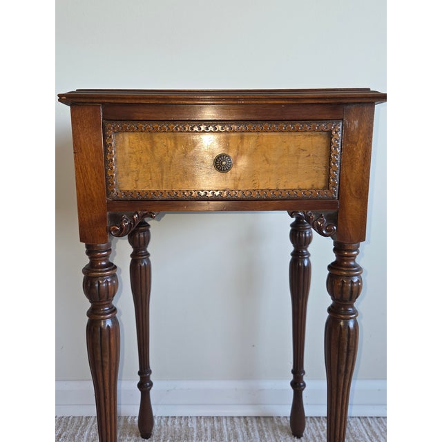This antique Sheraton style side table dates from the early 20th century and is constructed from mahogany. This piece...
