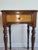 This antique Sheraton style side table dates from the early 20th century and is constructed from mahogany. This piece...