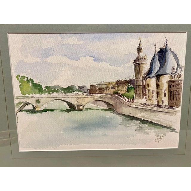 This is a wonderful watercolor painting of the view from the River Seine It has a very simple painterly feel and the...