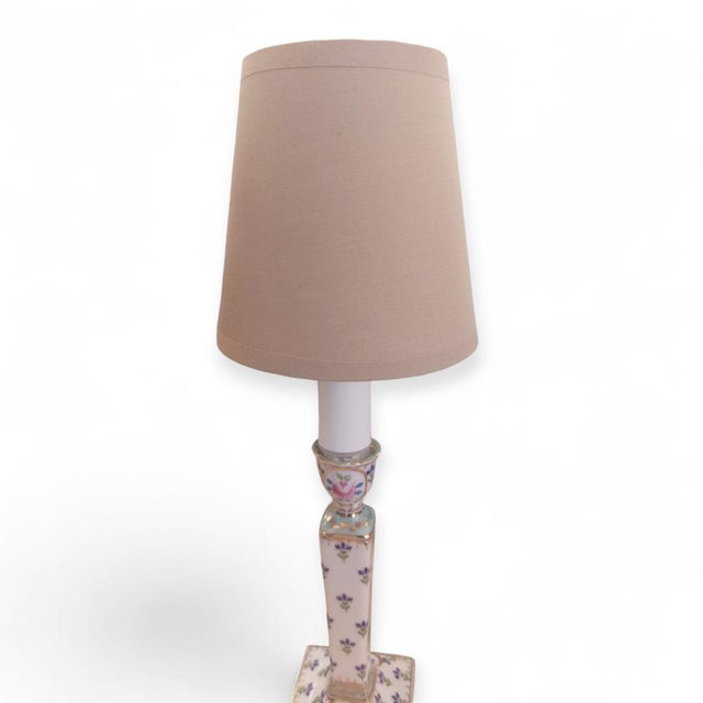 Pair of classic-style lamps with a square marble base featuring hand-painted ornamental motifs. The elegance of the hand-...