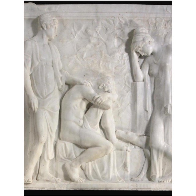 This solid marble hand-carved relief of Iphigenia in Tauris captures a dramatic scene from Greek mythology, beautifully...