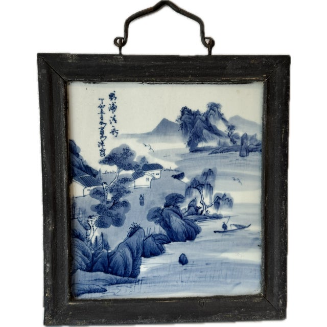An antique set of four Chinese porcelain plaques, each hand-painted in underglaze cobalt blue with a mountain-and-water...