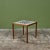 Square game table in the style of Gordon & Jane Martz. The table top is inlaid with white ceramic tiles with a...