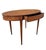 Elegant oval side table crafted in wood and richly decorated with fine marquetry, inspired by the Louis XVI style. The...