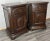 A striking pair of Vintage French bedside cabinets crafted from dark-stained oak, featuring rich panelled detailing and...