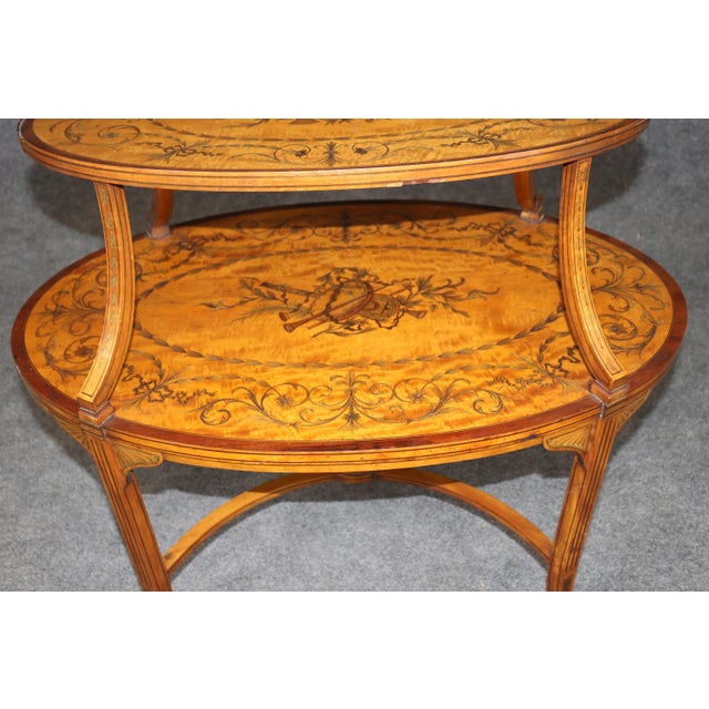 This exceptional Louis XVI style dessert table is a masterful example of fine European cabinetmaking, combining graceful...
