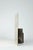 In In Sospeso, presence and reflection intertwine in a delicate play of appearances. The Bronze Fantasy cylinder holds a...
