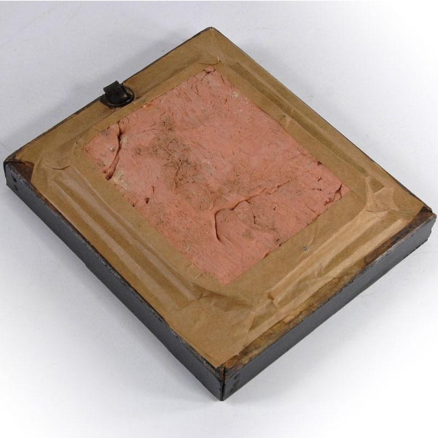 This decorative bas-relief is made of terracotta in a beautiful, warm shade of light brown. It is framed and protected by...