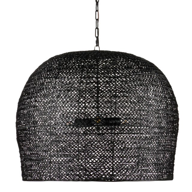The Piero Large Black Chandelier may appear to be woven from a natural plant material but it is made of iron in a satin...