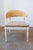 This Swedish Gustavian-style painted wood tub chair dates to the late 19th century and showcases curving lines, carved...