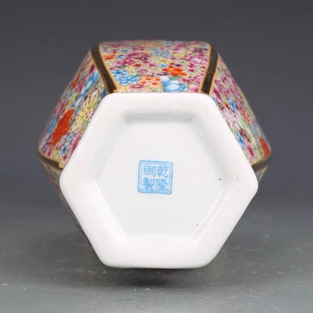 This magnificent vase features a classic hexagonal (six-sided) form with a flared rim and a distinctive, angular body. It...