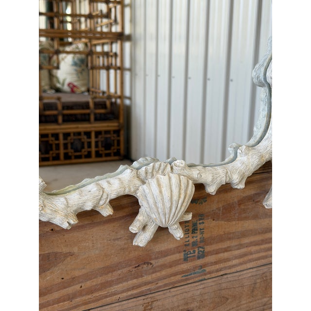Exceptional vintage sculptural wall mirror by Mark Roberts featuring an elaborate faux bois and coral-inspired frame...