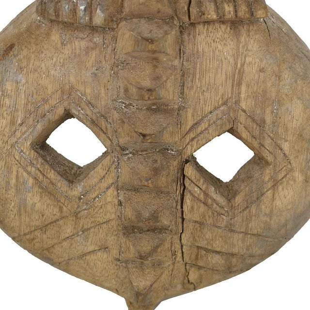 Step into the captivating world of Ivorian artistry with our authentic Senufo Figural Mask from CÃ´te d'Ivoire....