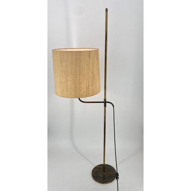 A floor lamp *by florian schulz *germany, around 1960 *the lamp is still manufactured in various versions today. However,...