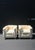 A substantial and beautifully made pair of LC2‑style modernist armchairs featuring polished tubular chrome frames and...