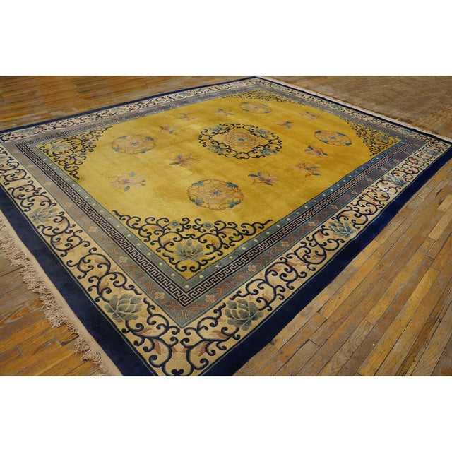 Antique Yellow Rectangle Wool 1920s Hand Knotted Pile Rug, Circa Date: 1920s. This exceptional Chinese Peking carpet,...