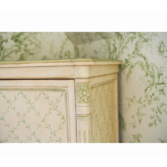 Delightfully whimsical and exquisitely detailed, this hand-painted armoire by celebrated decorative artist and furniture...