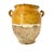 Antique French terracotta confit jar featuring a bright yellow or honey-colored glaze.