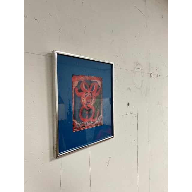 Brilliant colors in this Batik painting by NJ Artist Marion Knudsen. Titled Red Bow. Artist signed and framed in a brushed...