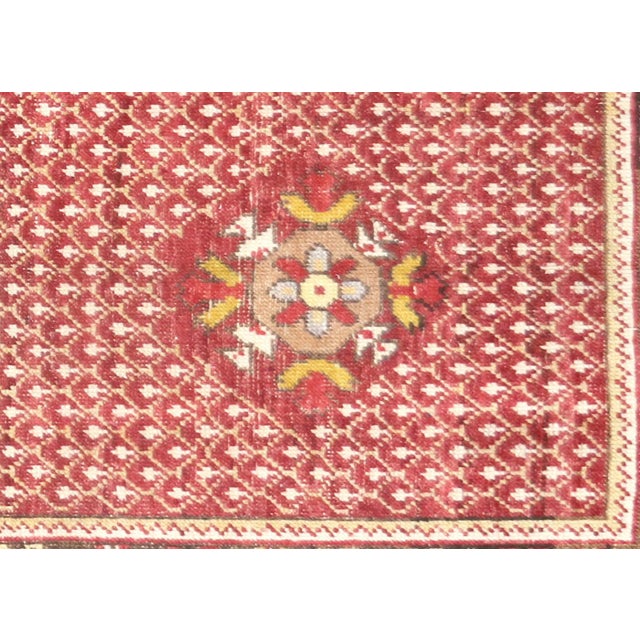 This vintage Turkish Oushak rug, measuring 3'11" x 7'4", is handwoven with wool on a wool foundation in Western Turkey’s...
